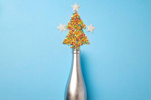 Festive background with champagne bottle and confetti