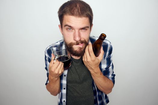 bearded man drinking beer alcohol emotion light background