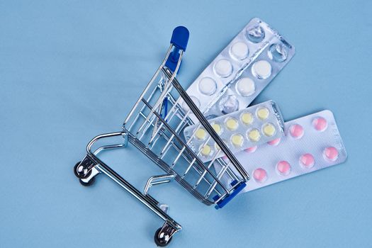 pill cart shopping medicine pharmacy blue background
