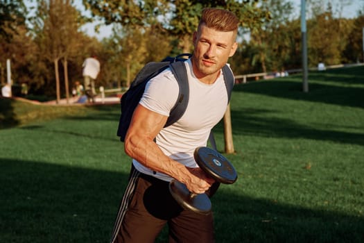 sportive man workout in the park morning motivation