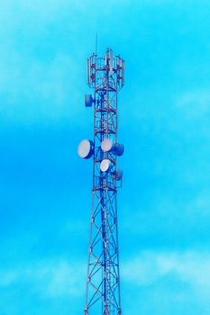 Mobile techology telecommunications network tower on a background of blue sky