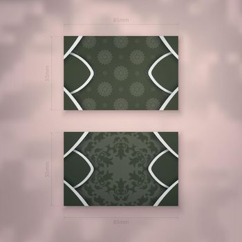 Dark green business card with vintage white pattern for your business.