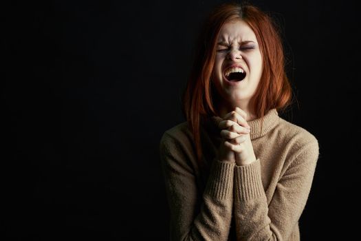 red-haired woman with bruises under her eyes scared crying depression