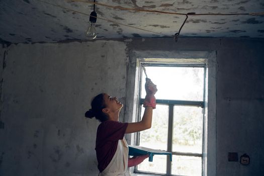 woman paints house decoration interior renovation painter