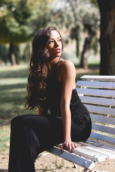 Pretty girl wearing black clothes in a park