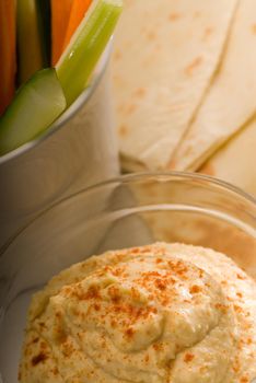 hummus dip with pita bread and vegetable