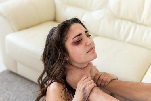 Victim, abuse and domestic violence - Woman being abused and strangled by strong man