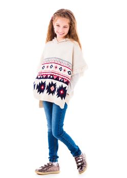 Adorable little girl in warm beige poncho