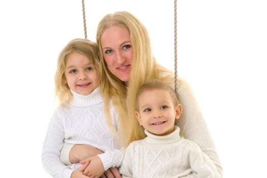 Happy Family of Mother and Two Kids Sitting Together on Rope Swing