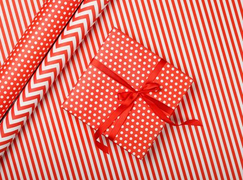 Packing gifts with red and white paper