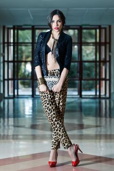 Young beautiful woman wearing leopard pants