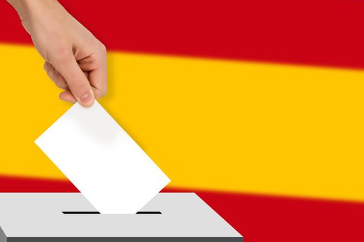 hand drops the ballot election against the background of the spain flag, concept of state elections, referendum