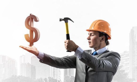 Businessman going to crash with hammer dollar
