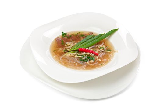 Asian noodle soup with beef isolated on white