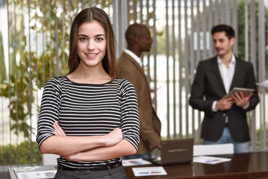 Businesswoman leader with arms crossed in working environment