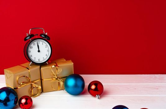 Christmas and New Year countdown concept with alarm clock