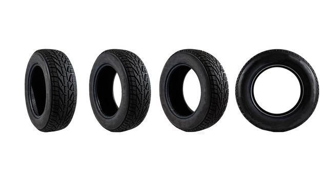 set of black car tires lined up horizontally on white background