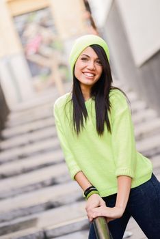 Young woman with green eyes in urban background