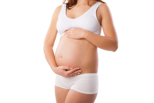 Beautiful belly of young attractive pregnant woman