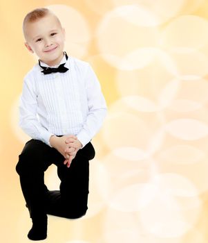 little boy in a white shirt and tie.