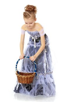 A girl holds a wicker basket.