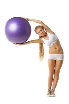 Young woman with fit-ball isolated over white