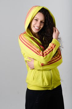 Young cheerful smiling woman in sports wear