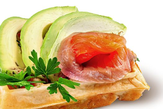 Closeup french waffle with avocado and salmon