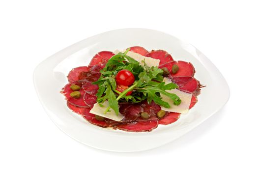 Beef carpaccio appetizer with ruccola isolated on white