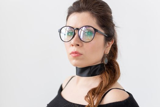 Portrait, fashion, style and people concept - woman in glasses and choker on white background