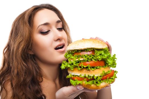 Happy Young Woman Eating big yummy Burger isolated