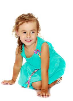 Little girl in blue dress on her knees