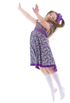 girl jumping spinning and waving hands