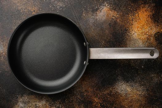 Empty frying pan with copy space for text or food with copy space for text or food, top view flat lay , on old dark rustic table background