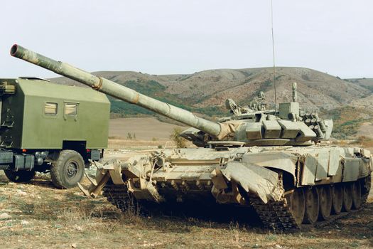 Russian battle tanks at tankodrome in mountains