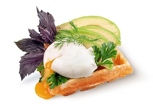 French waffle with poached egg and avocado