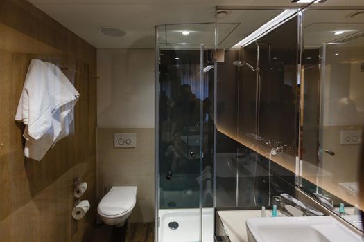 Interior of a bathroom is combined with toilet, nobody