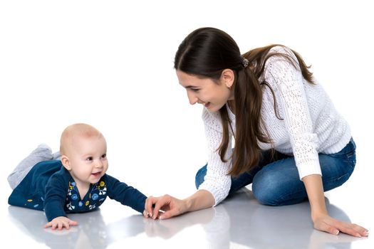 Mom with little daughter on the floor on a white background.