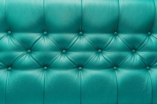 Green or aquamarine leather upholstery sofa with pattern button design furniture style decor texture background