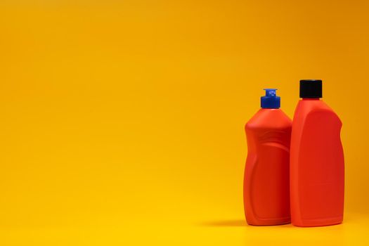 House cleaning detergent bottles on a yellow background