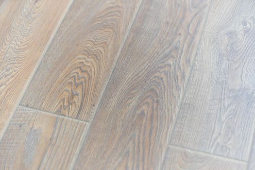 Laminate background. Wooden laminate and parquet boards for the floor in interior design. Texture and pattern of natural wood.