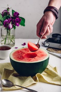 The Spoon with Piece of Watermelon in Hand