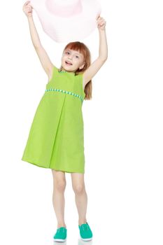 A little girl in a summer green dress.