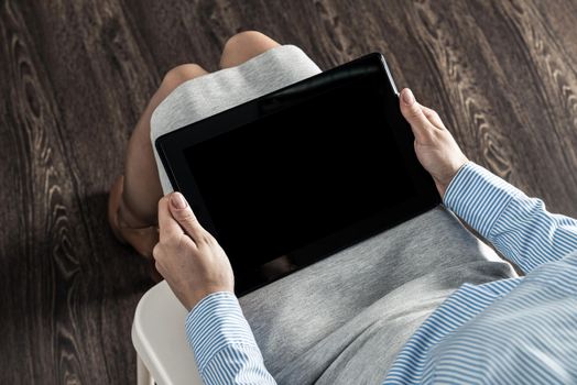 business woman with tablet on her lap