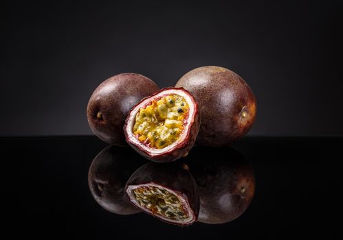 Whole and half passion fruits