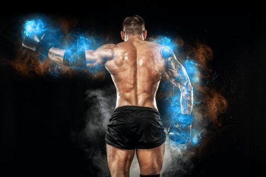 Athlete bodybuilder in blue energy lights. Boxing man posing on black background. Sporty guy male . Fitness muscled man. Sport concept