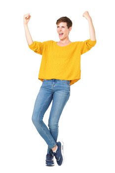 Full length happy young woman with short hair cheering and punching the air
