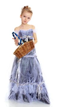 A girl holds a wicker basket.