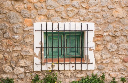 Design, architecture and exterior concept - Small window with lattice on the white facade