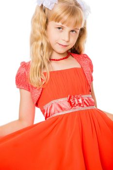 Beautiful little girl with long, blonde ponytails on her head in a bright orange dress . close-up-Isolated on white background